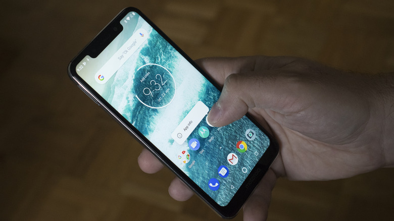 Person holding Motorola One Vision Phone