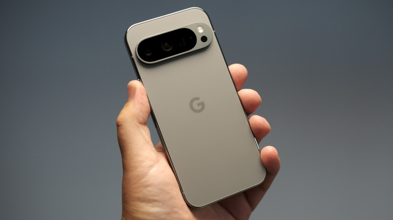A closeup of a Google Pixel Pro 9 in an individual's hand