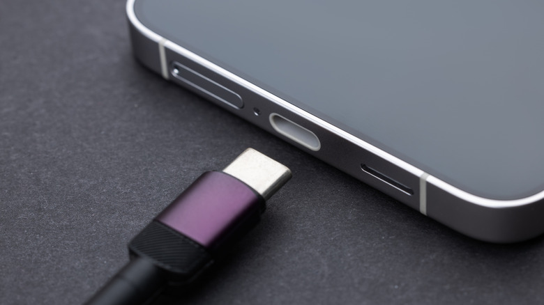 USB C cable plugging into the charging port of a smartphone.