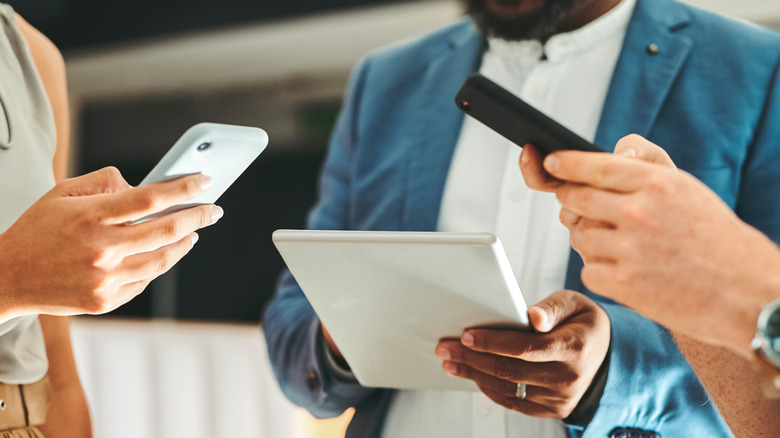 People using phones and tablets