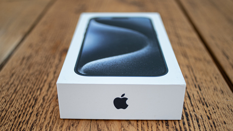 An iPhone retail box on a table.