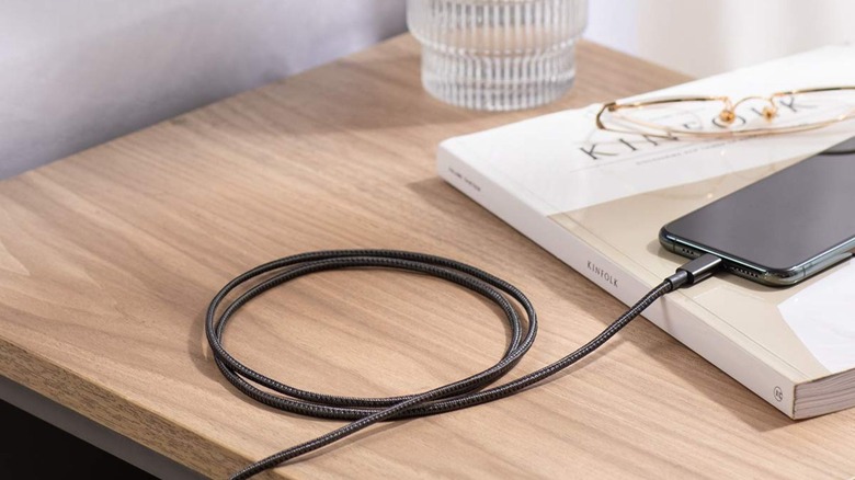 Anker Nylon cable charging phone on table
