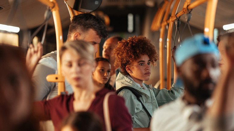 Curly-haired girl on public transit bus