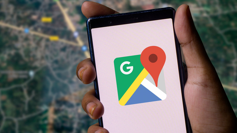 phone with Google Maps icon loading on it