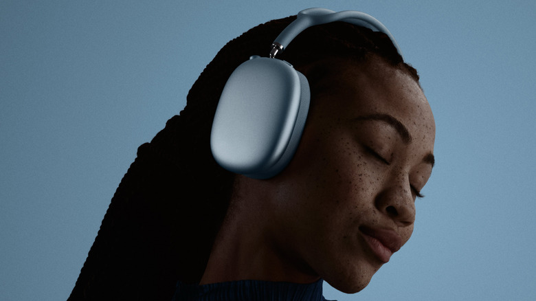 A woman wearing AirPods Max 2