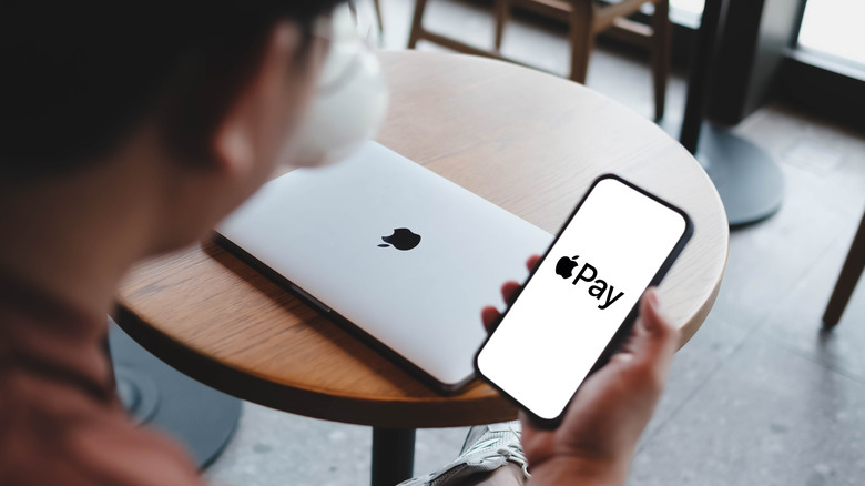 The Apple Pay logo on a smartphone display
