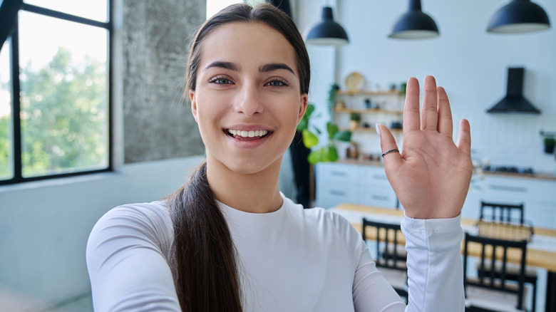 a woman using FaceTime looking at the camera