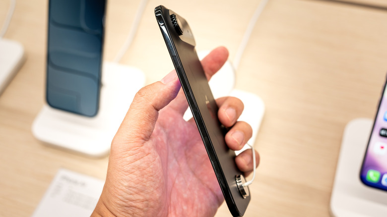 iPhone Air in a person's hand inside a store