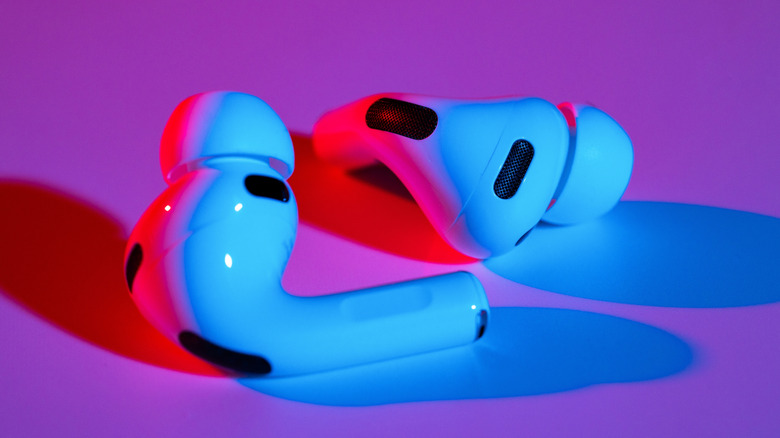 AirPods Pro on a table in blue and red lighting