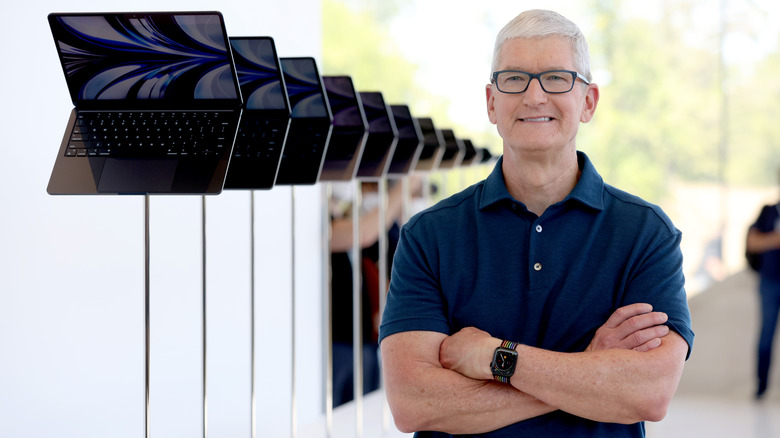 Apple's ex-CEO Tim Cook looks at brand-new redesigned MacBook Air laptops