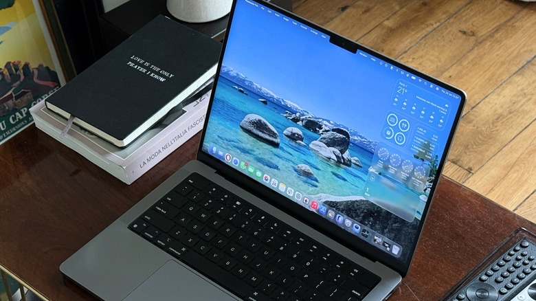 A MacBook Pro on a desk running macOS Tahoe