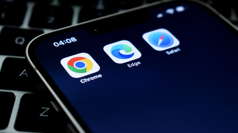 An iPhone showing the Chrome, Edge, and Safari browser app icons.