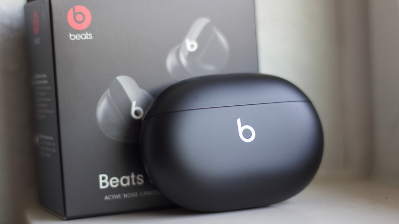 Beats Studio Buds placed in the front of their packaging