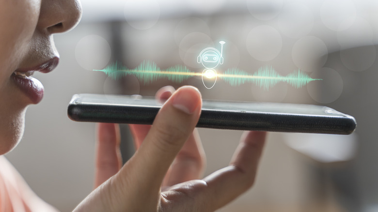 Woman using smartphone ai assistant with her voice