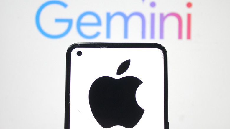 A blurred Gemini logo in the background. A smartphone with the Apple logo on it in the foreground.