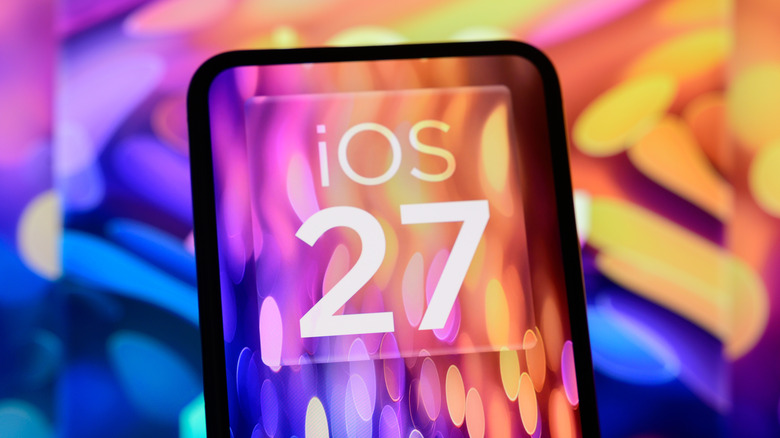 A cellphone displaying a mockup of iOS 27, the cellphone and the photo's background has a swirl of blue, purple, and orange colors