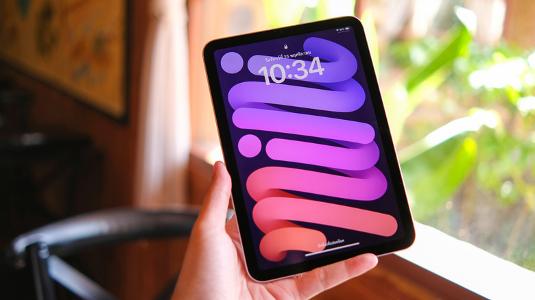 The iPad mini 7 (2024) in hand.