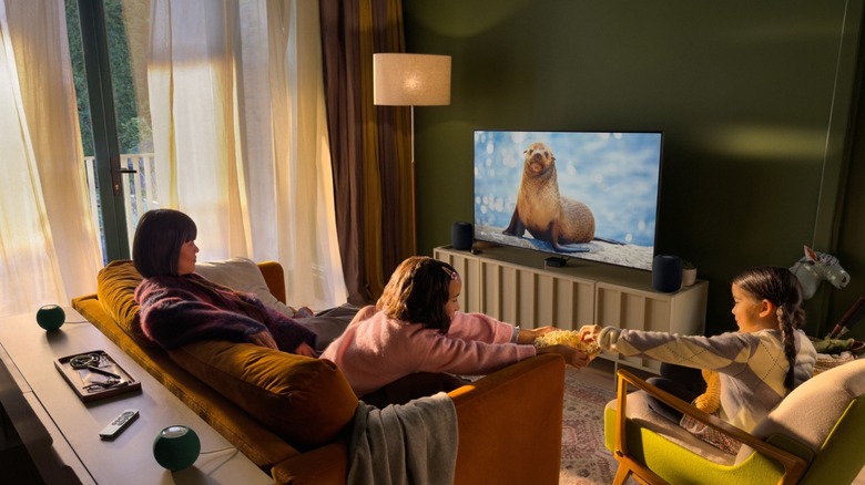 Family watching TV on Apple TV 4K