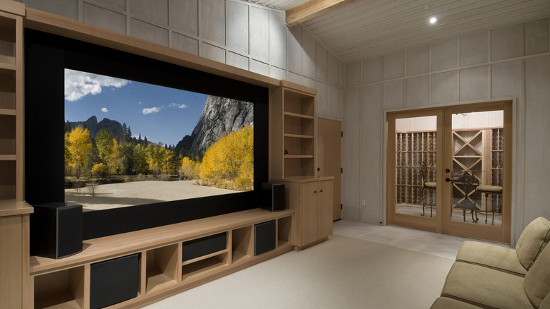 A home theater setup with a wall mounted TV