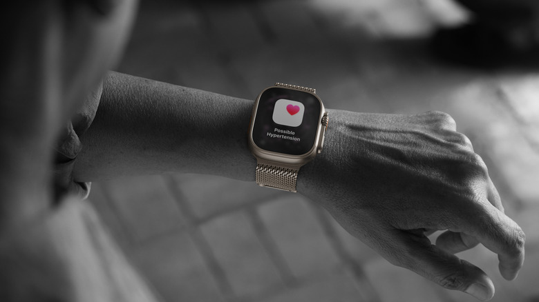Person wearing Apple Watch Ultra 3 with possible hypertension notification showing up