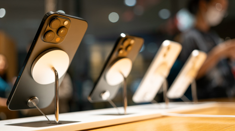 iPhones lined up on an Apple retail store display