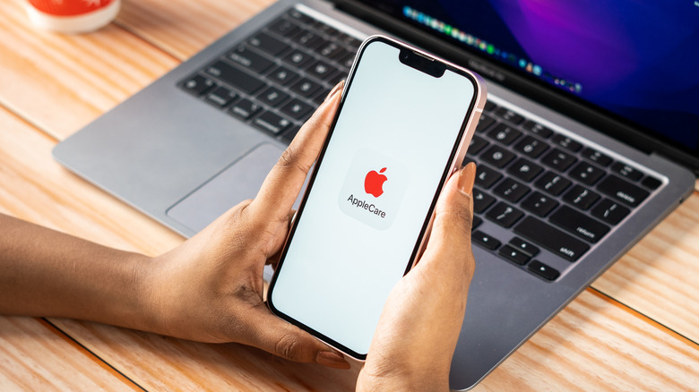 Apple Care on phone screen stock image