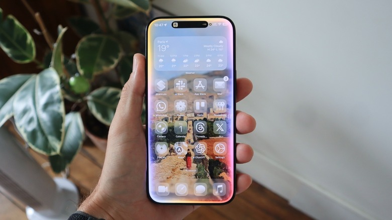 Apple's Liquid Glass UI on an iPhone running iOS 26