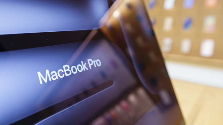 A close-up of a MacBook Pro display in a retail store.