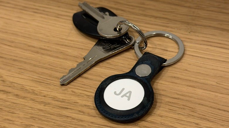 An engraved AirTag 2 with the letters 