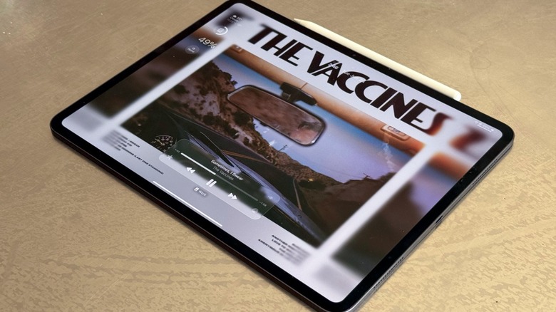 The iPad Pro on a table. It has the Apple Pencil Pro attached to it.