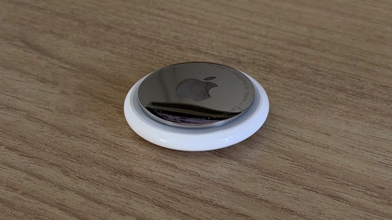 Apple's AirTag tracker is placed on a table.
