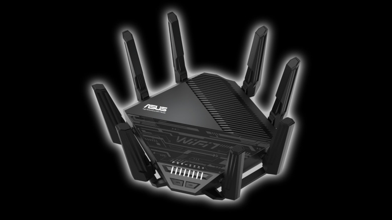 Asus multi-band router on black background.