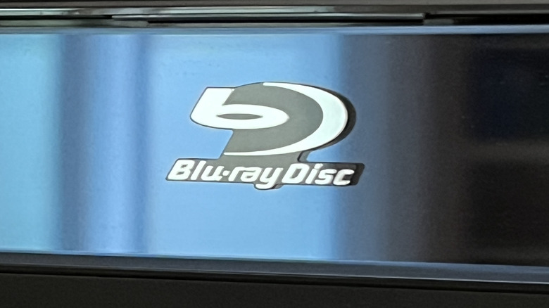Close-up of a Blu-ray Disc logo on a Blu-ray player