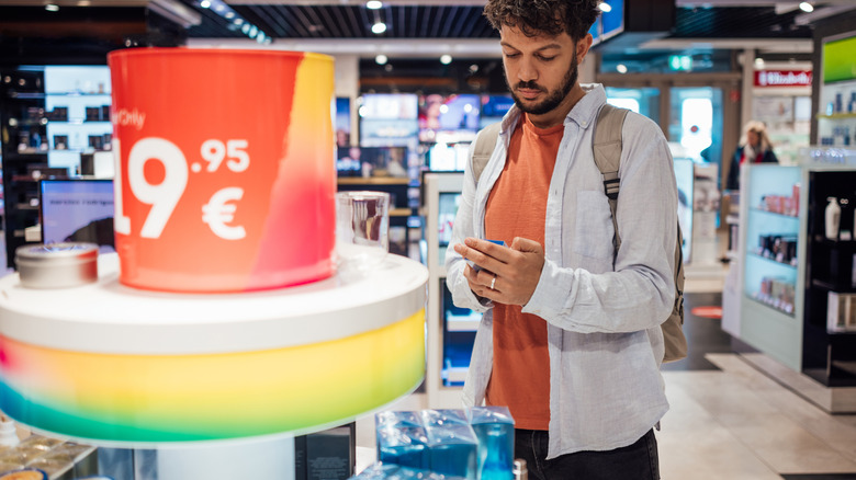 Someone shopping a duty-free store in a travel center.