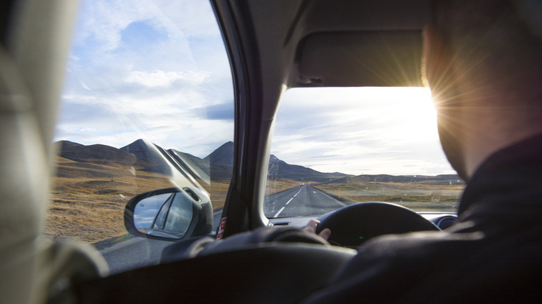 A man driving a car.