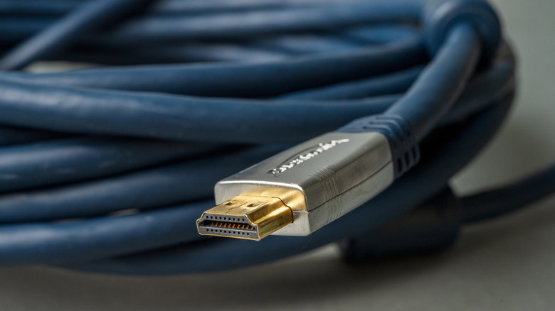 A close-up shot of an Amazon Basics gold-plated HDMI cable.