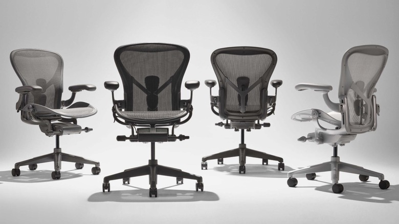 Four Herman Miller Aeron desk chairs.