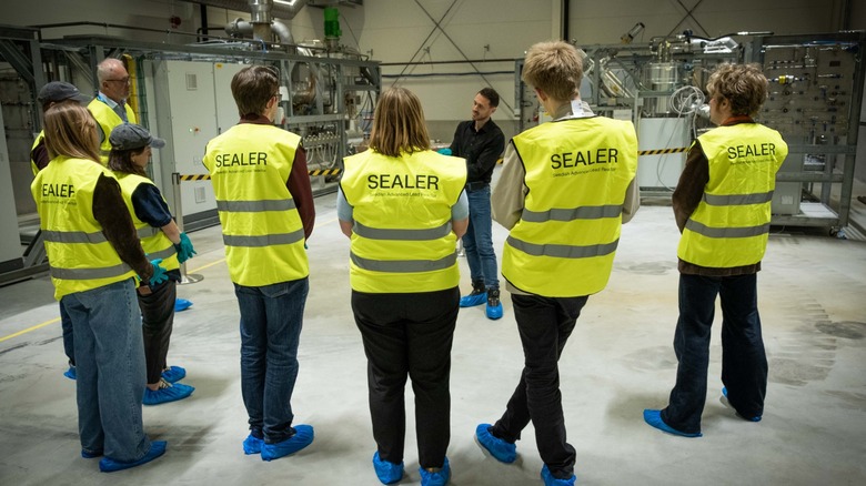 Politicians wearing yellow vests visiting Blykalla SEALER facility