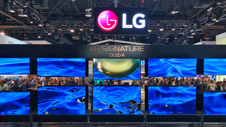 Rows of LG OLED screens at a trade show
