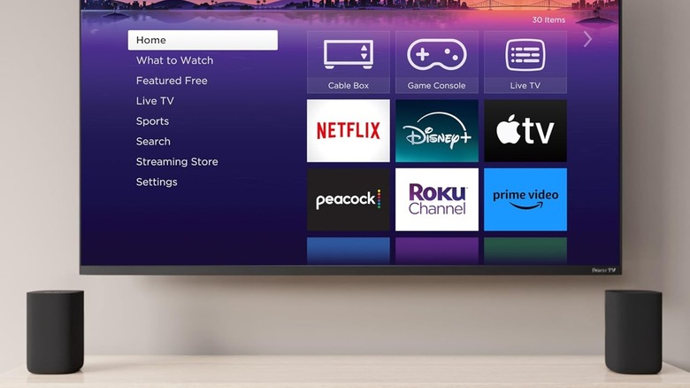 A set of Roku Wireless Speakers set up speakers in front of TV