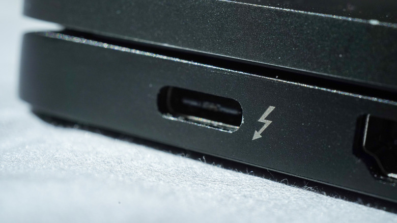 Close-up of a Thunderbolt 4 port on a black laptop