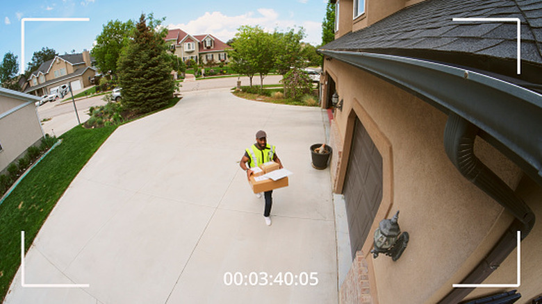footage from a home security camera with a man delivering packages