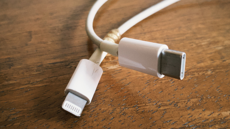 A Lightning to USB-C cable on a wood table