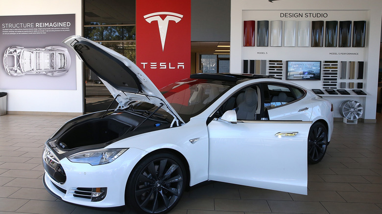 a Tesla vehicle on display in a dealership