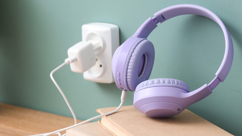 Wireless headphones being plugged in to charge