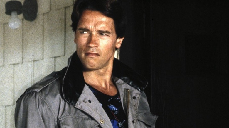The Terminator wearing a trenchcoat and looking to the side