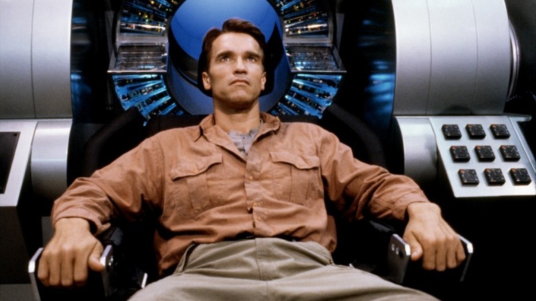 Douglas Quaid sitting in the memory-mining chair