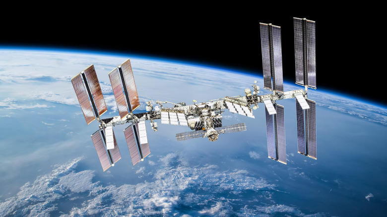 The ISS floats in space above the Earth