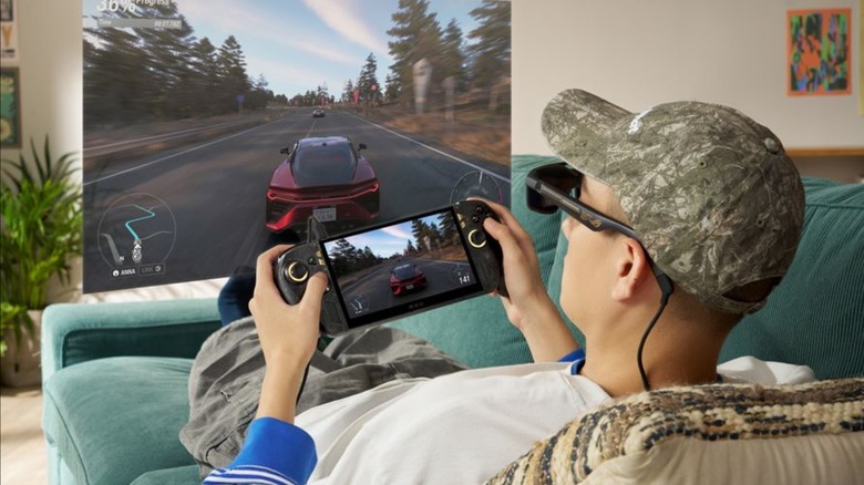 Man playing Asus ROG Xbox Ally X20 while wearing XREAL gaming AR glasses
