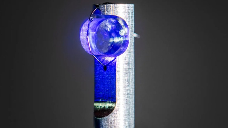 Calcium fluoride crystal infused with thorium atoms inside a nuclear clock